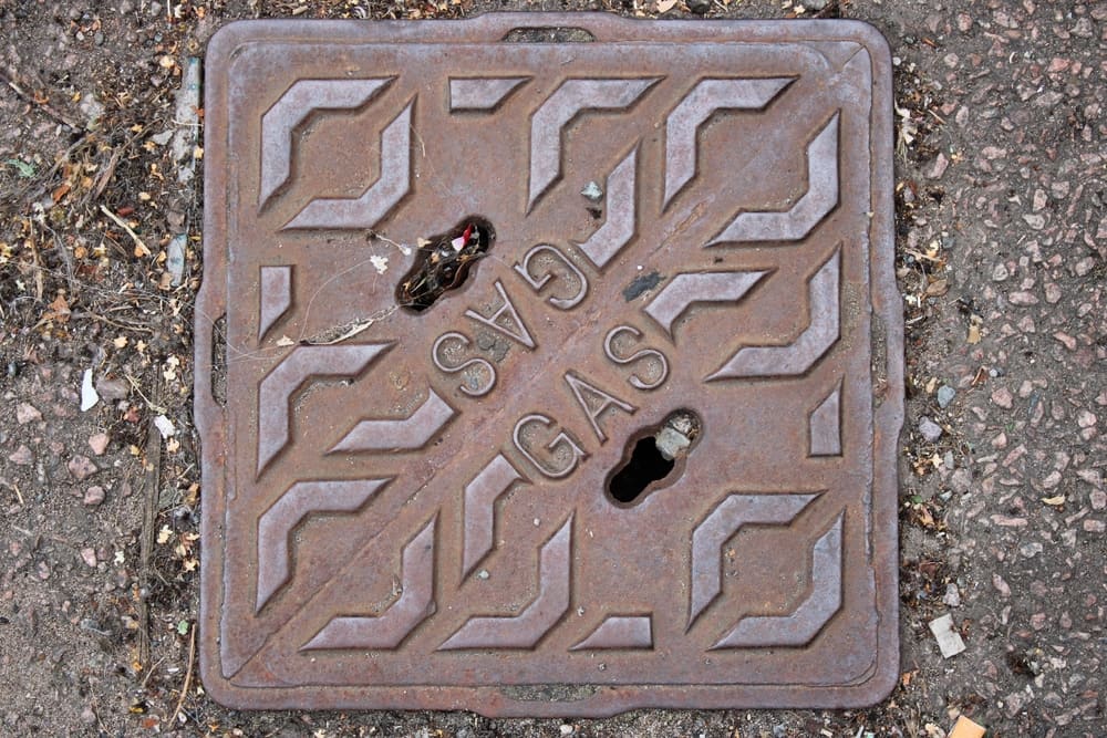 What is the difference between a sewer and a manhole